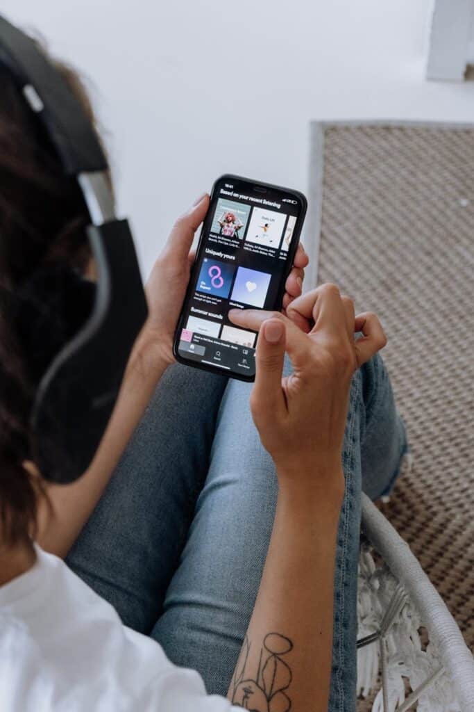 person listening to music on a smartphone